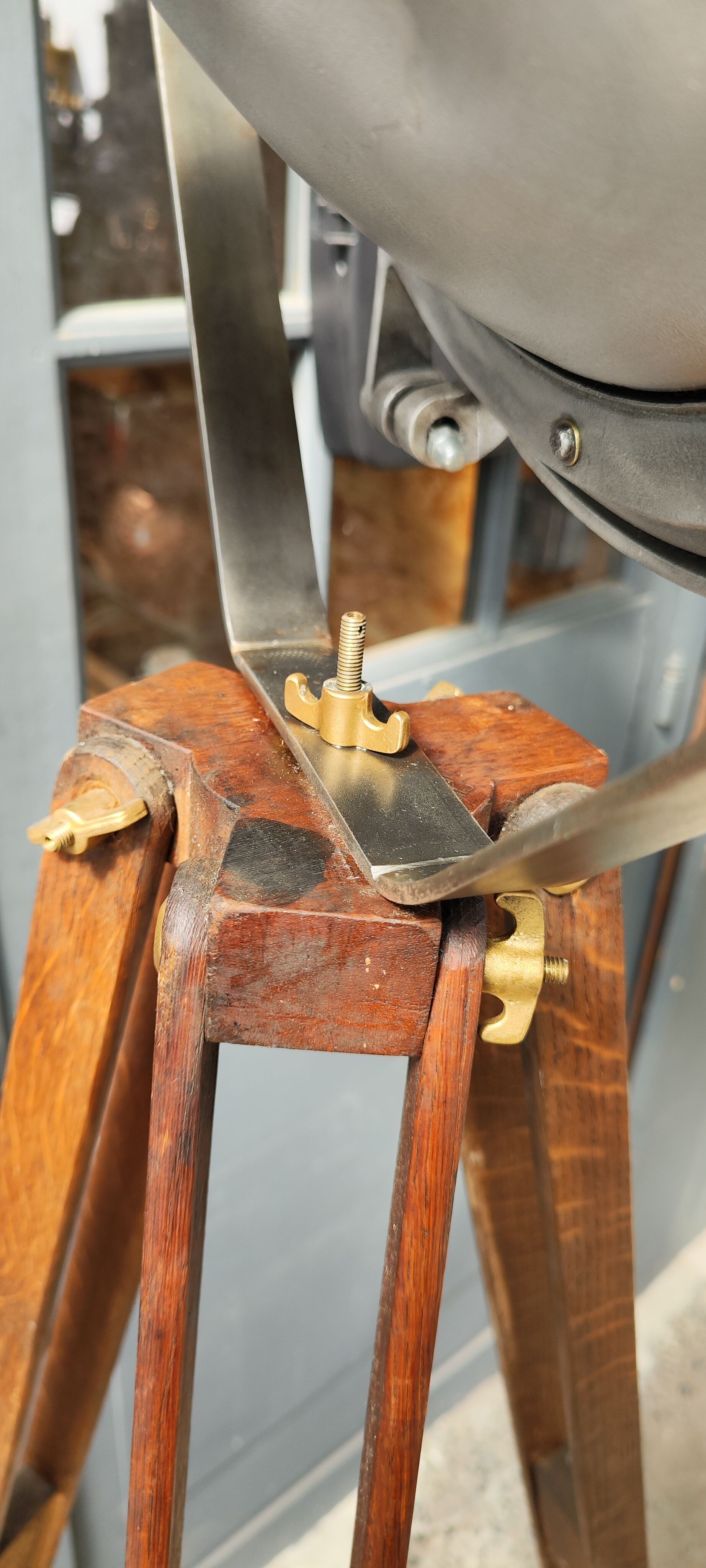 Industrial projector on tripod waxed wood