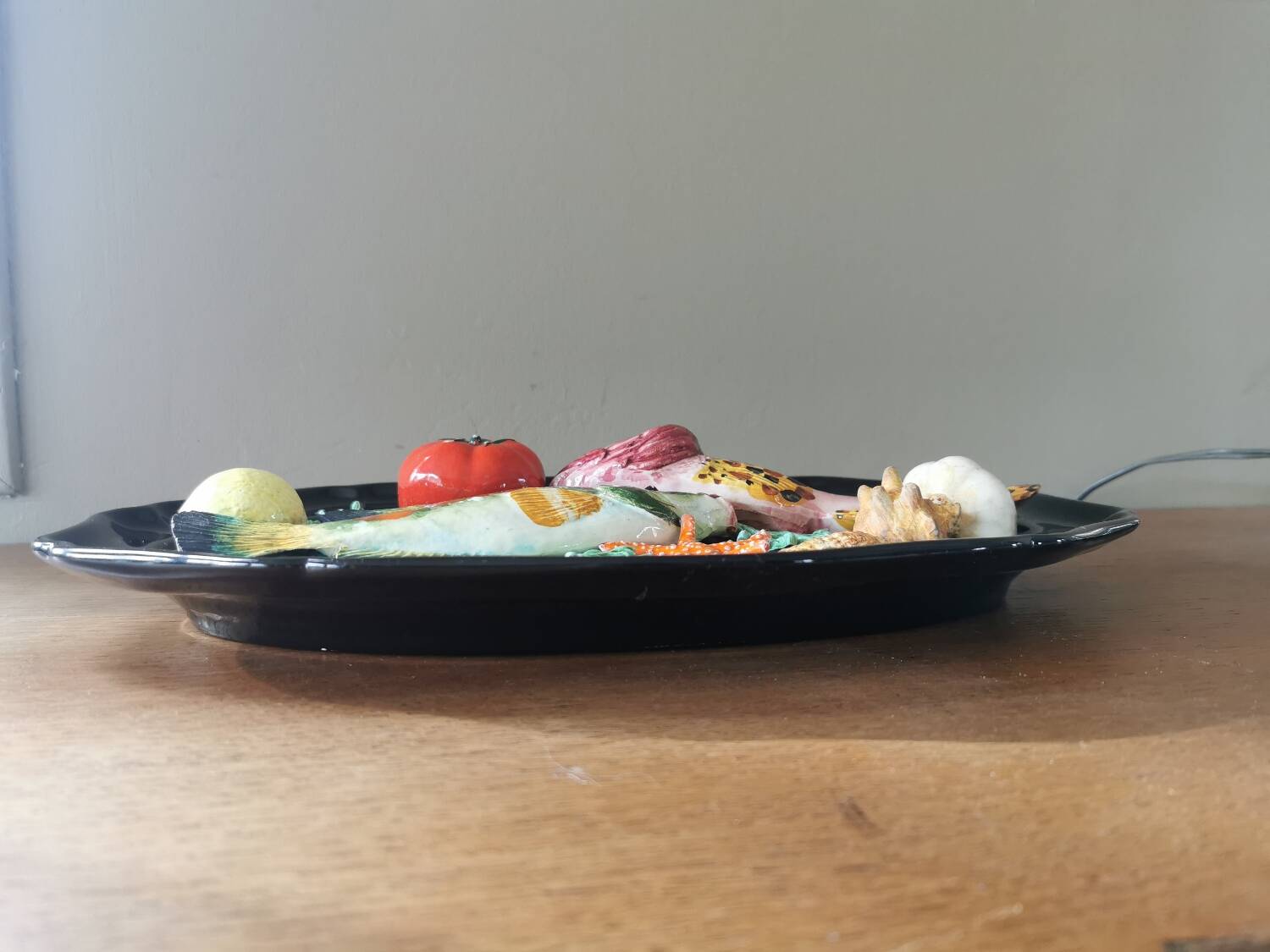 Vintage barbotine dish with fish decoration in relief