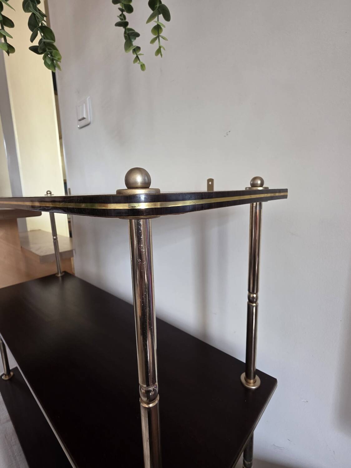 Wooden shelf with gold metal