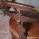 Barber chair in wood and leather with adjustable headrest, office chair.