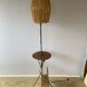 Wrought iron floor lamp with magazine holder and sisal shade, 1950s