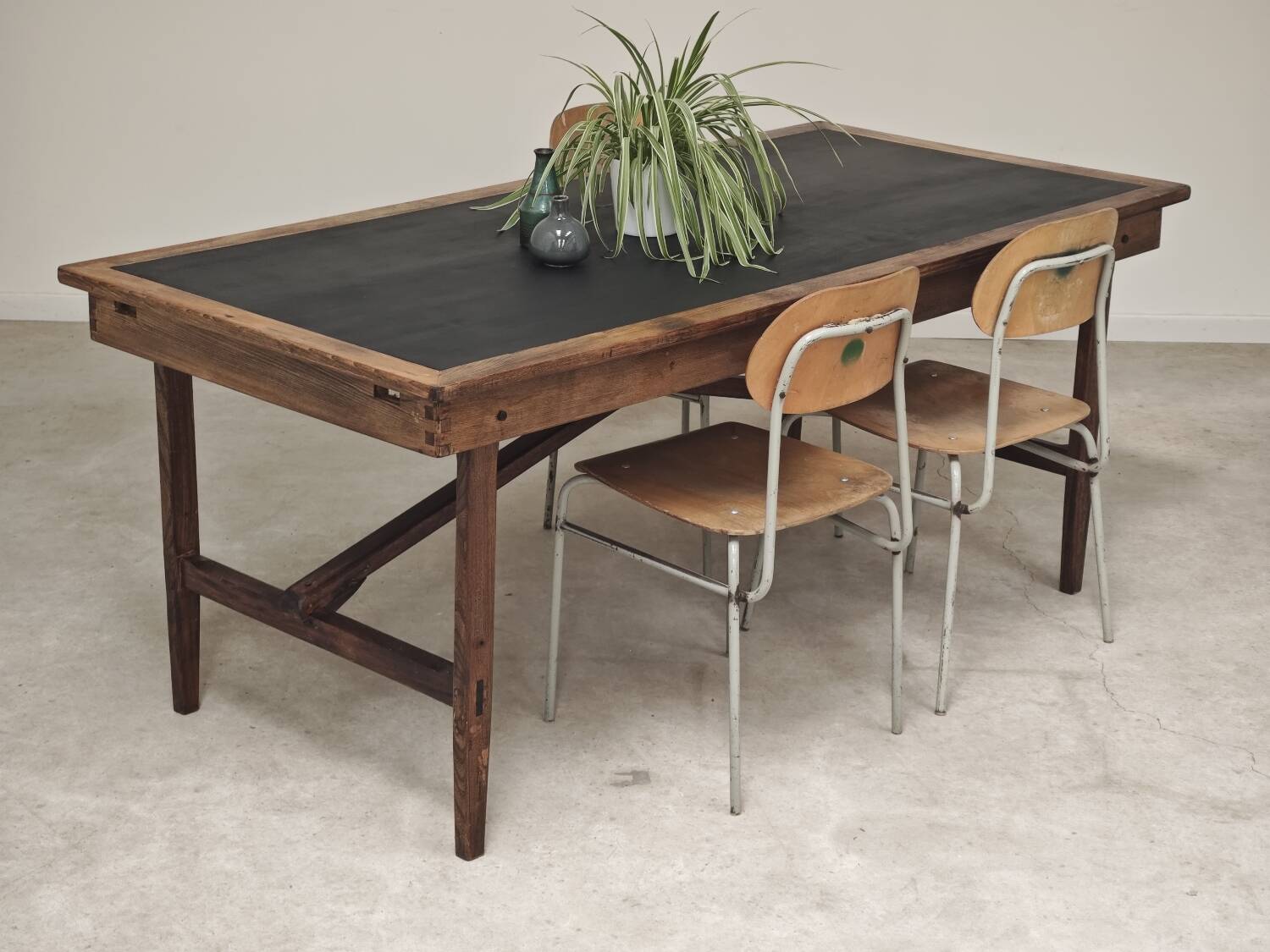 Vintage workshop folding table in oak with a hand-patinated black top.