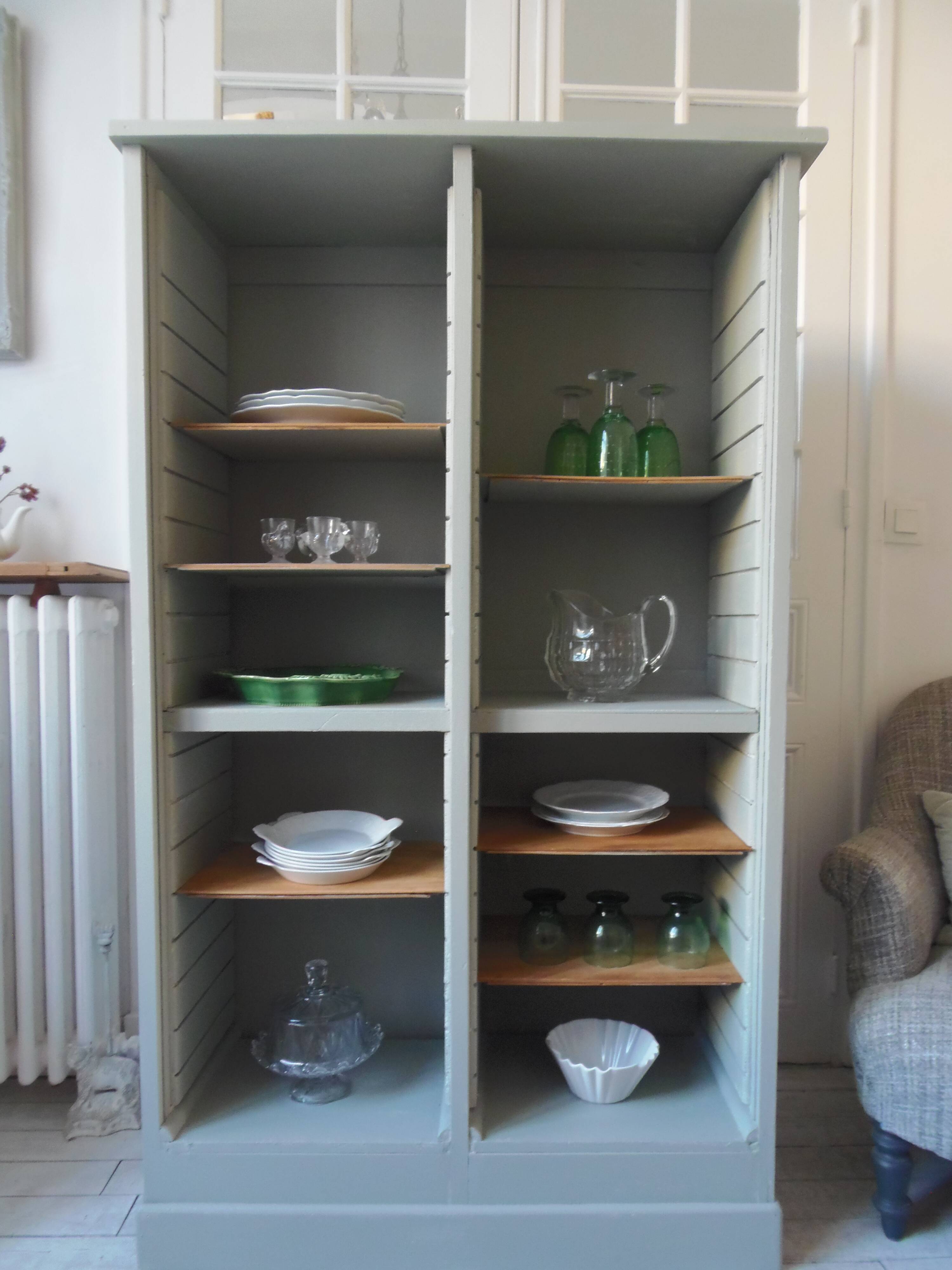 Vintage furniture transformed into a bookcase, verdigris patinated sideboard.