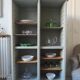Vintage furniture transformed into a bookcase, verdigris patinated sideboard.