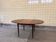 Vintage extendable round teak dining table