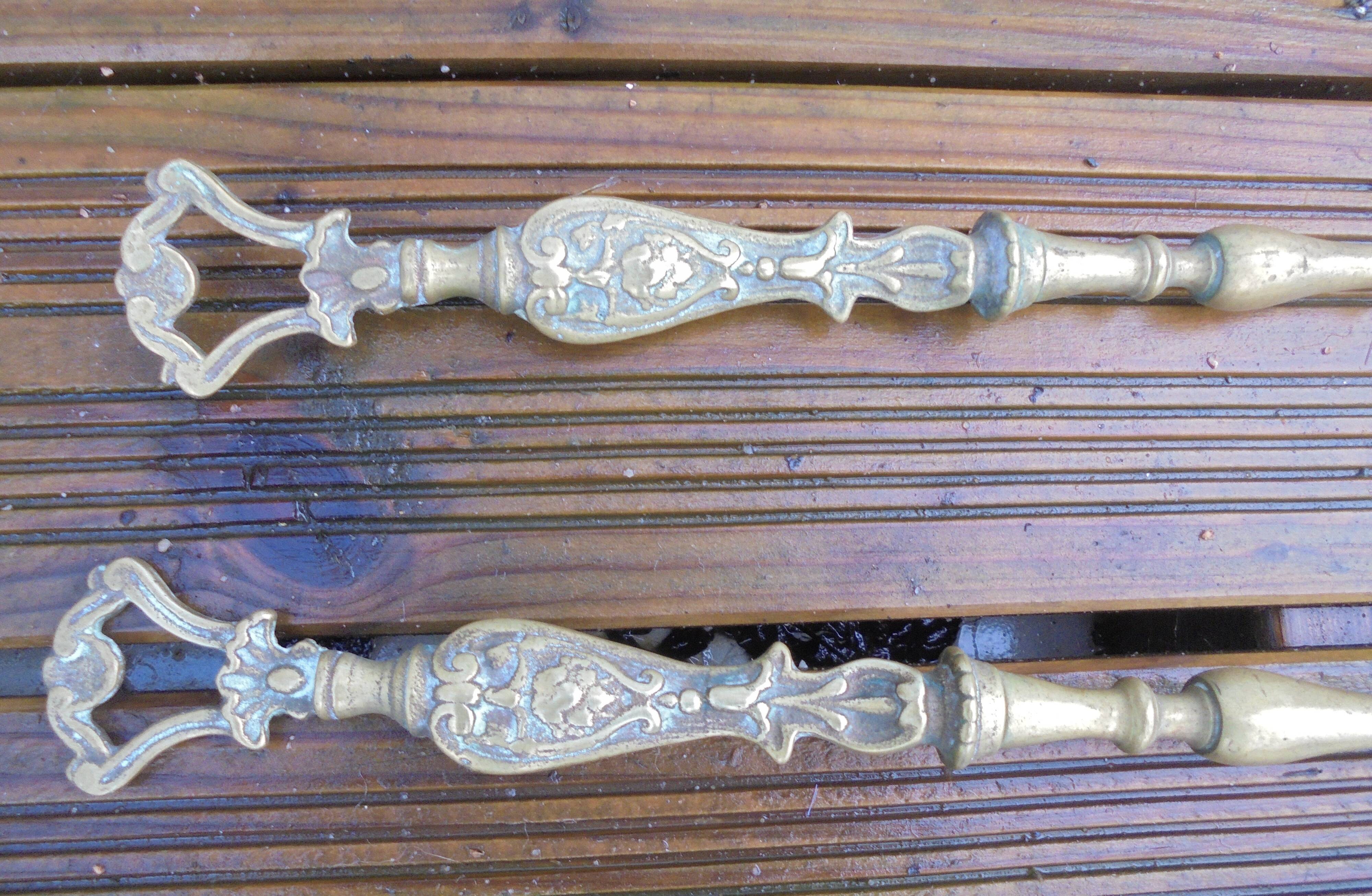 Old bronze fireplace servant decor medallion shovel clamp brooms