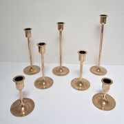 Series of seven candle holders solid brass