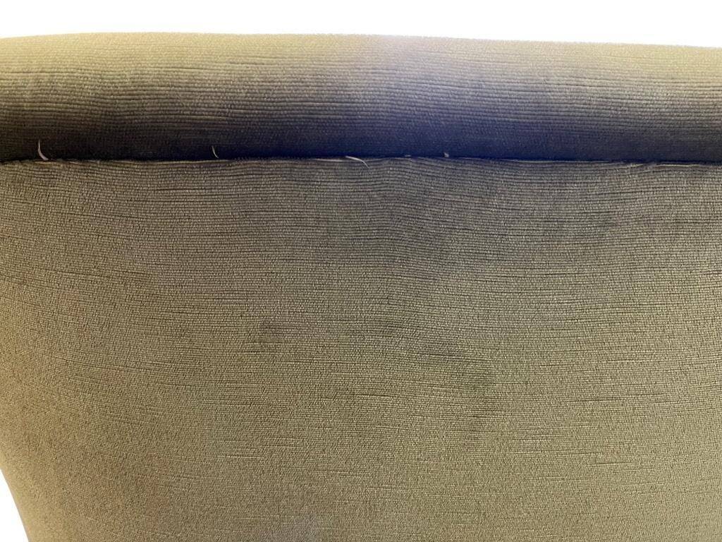 Vintage green two-seater sofa with fringes