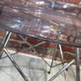 Suite of four plexiglass and metal chairs