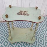 Shelf coils monogrammed patinated wood