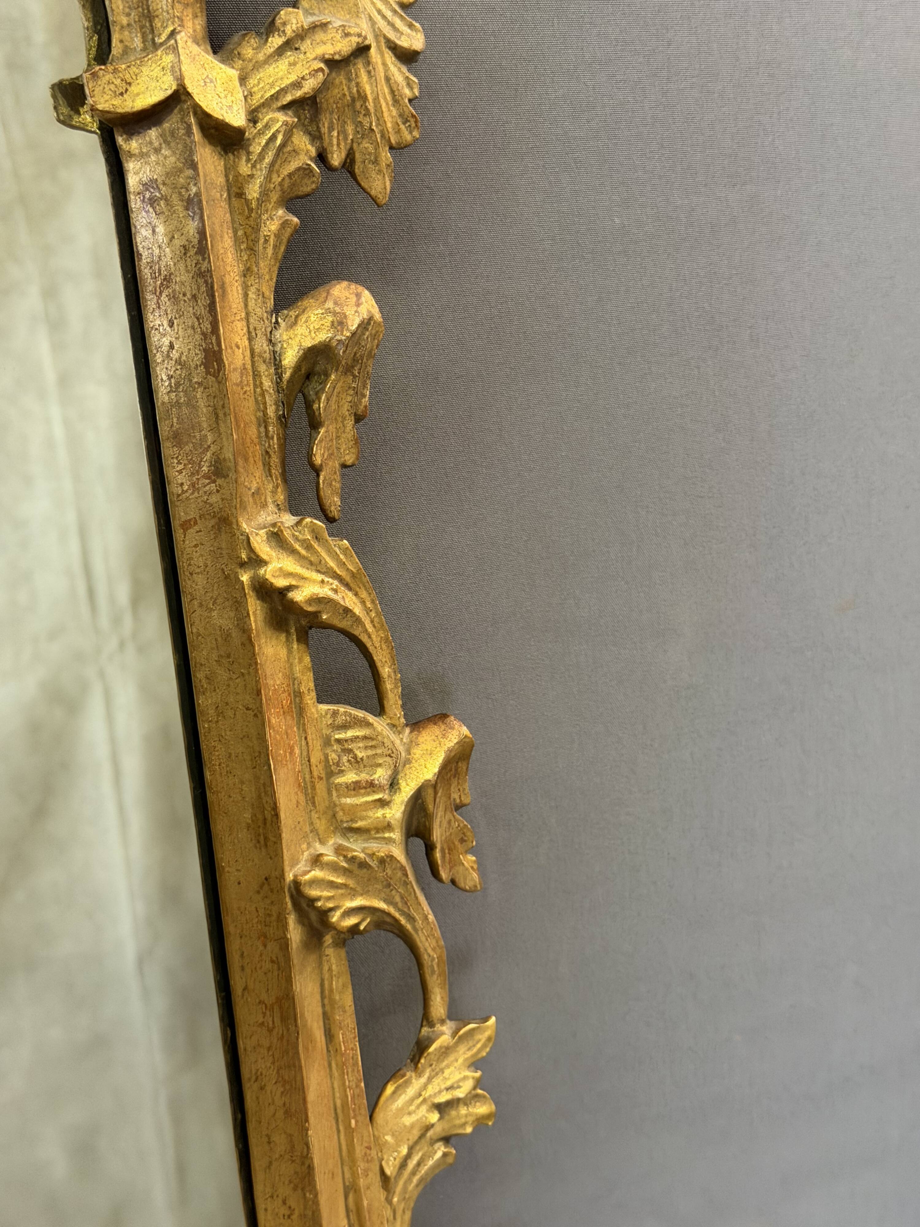 Italian mirror in gilded wood from the 19th century.