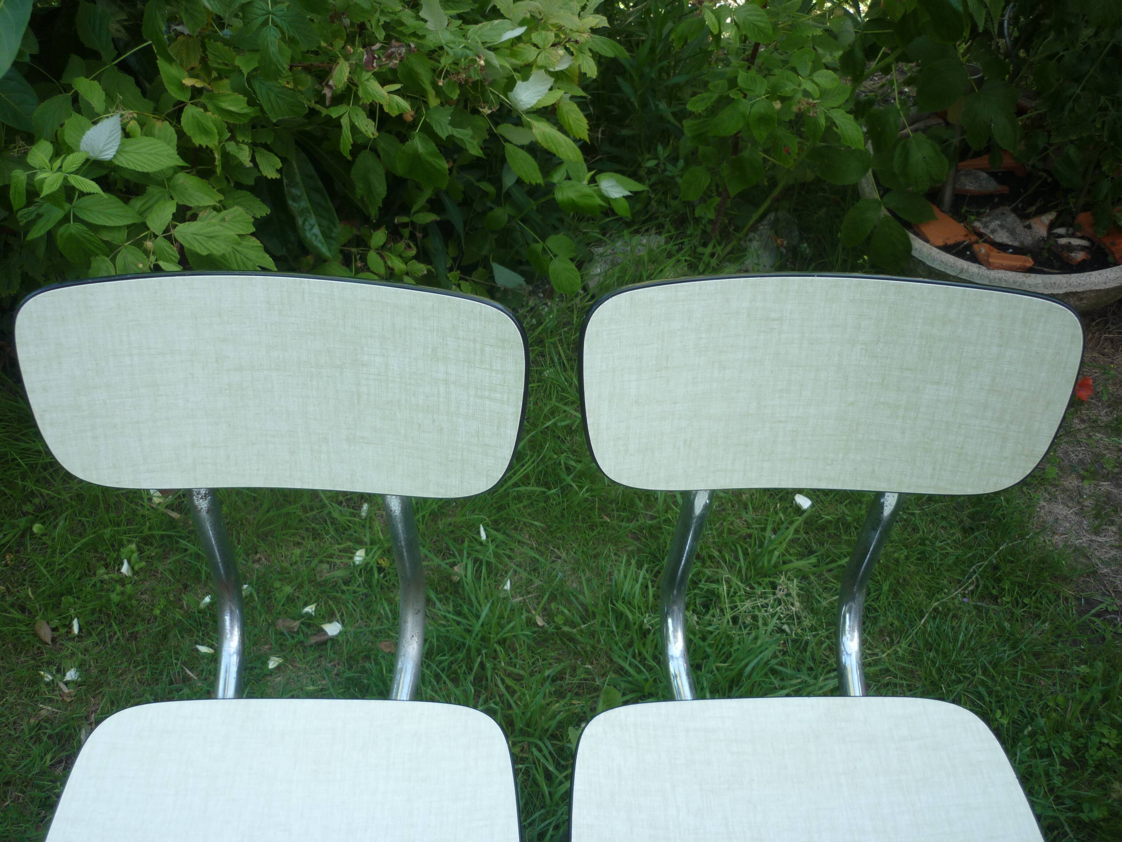 Pair of pale yellow formica chairs