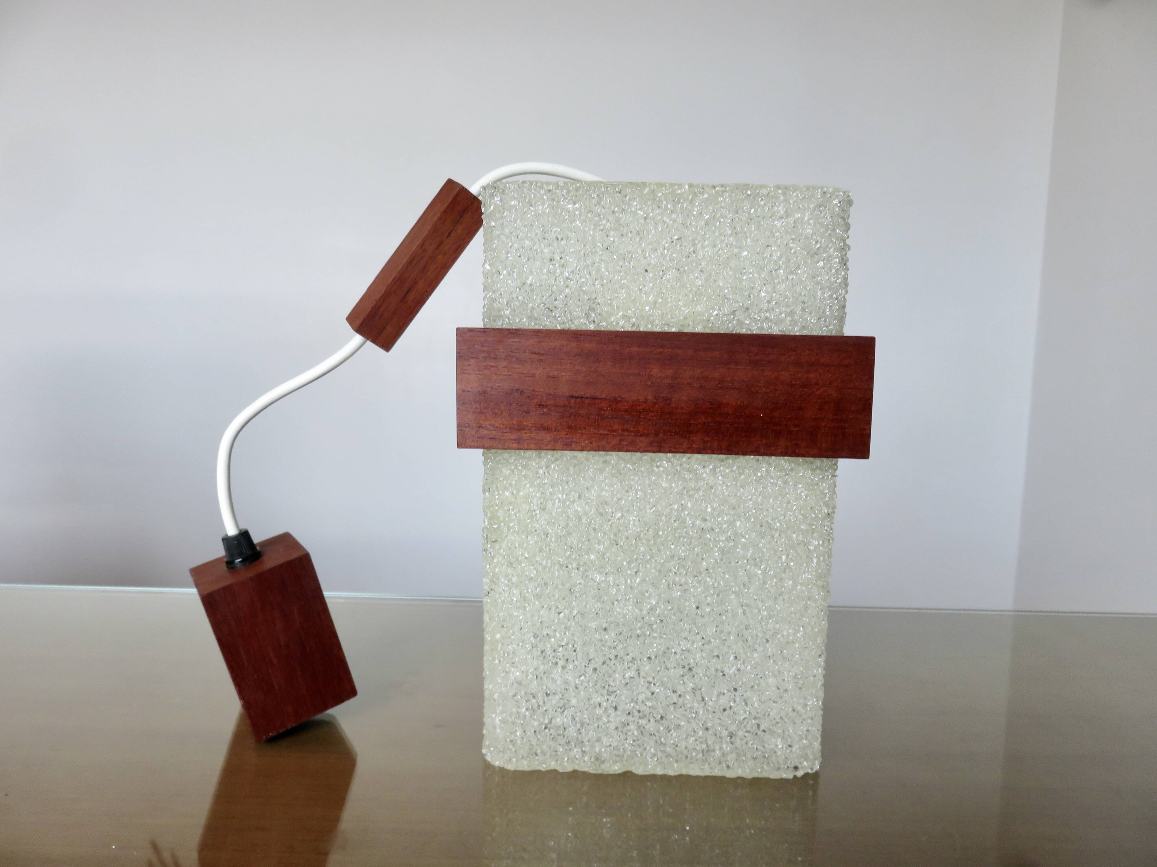 Pair of Scandinavian pendant lights in teak and perspex, 1970s.