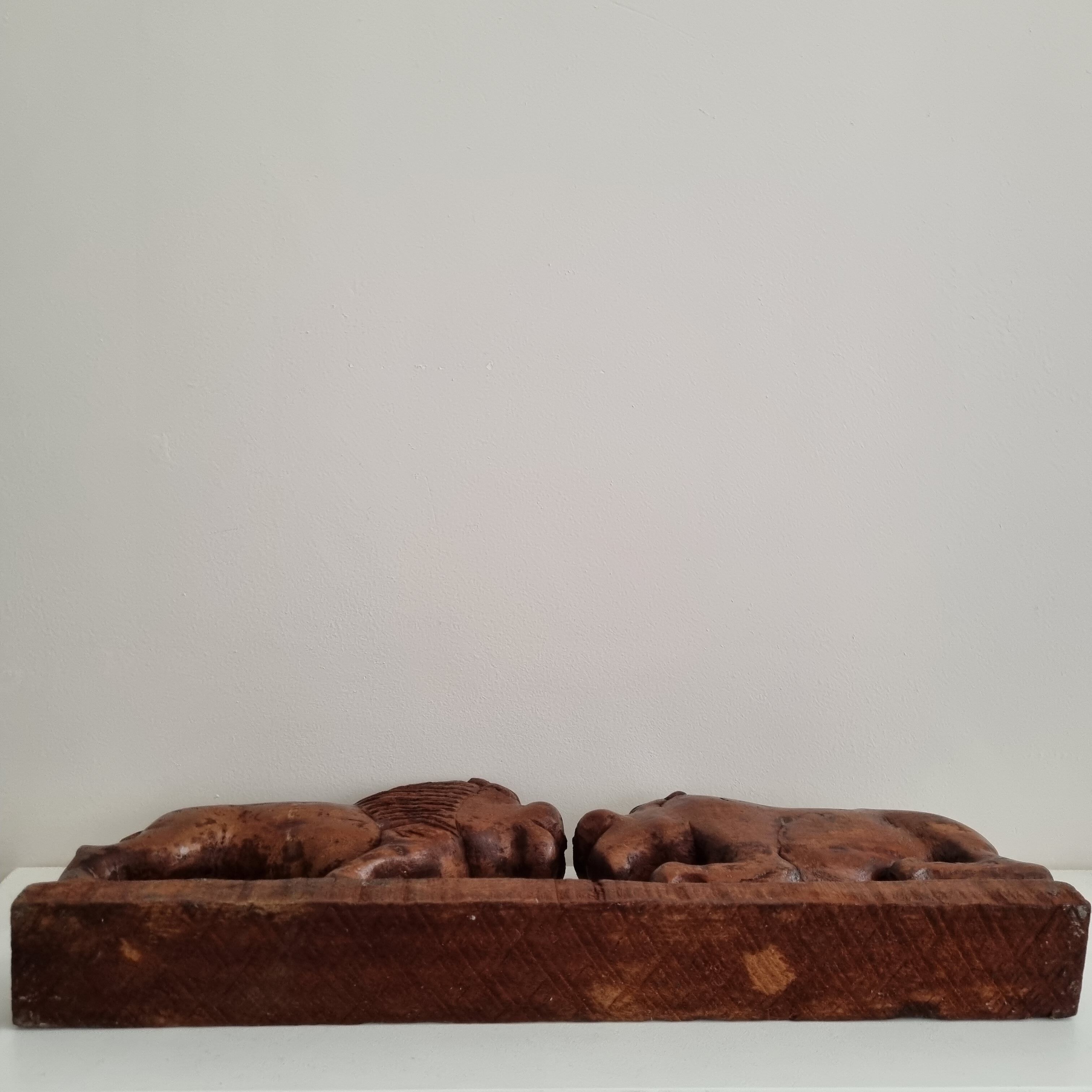 Lion and hippopotamus wood sculpture