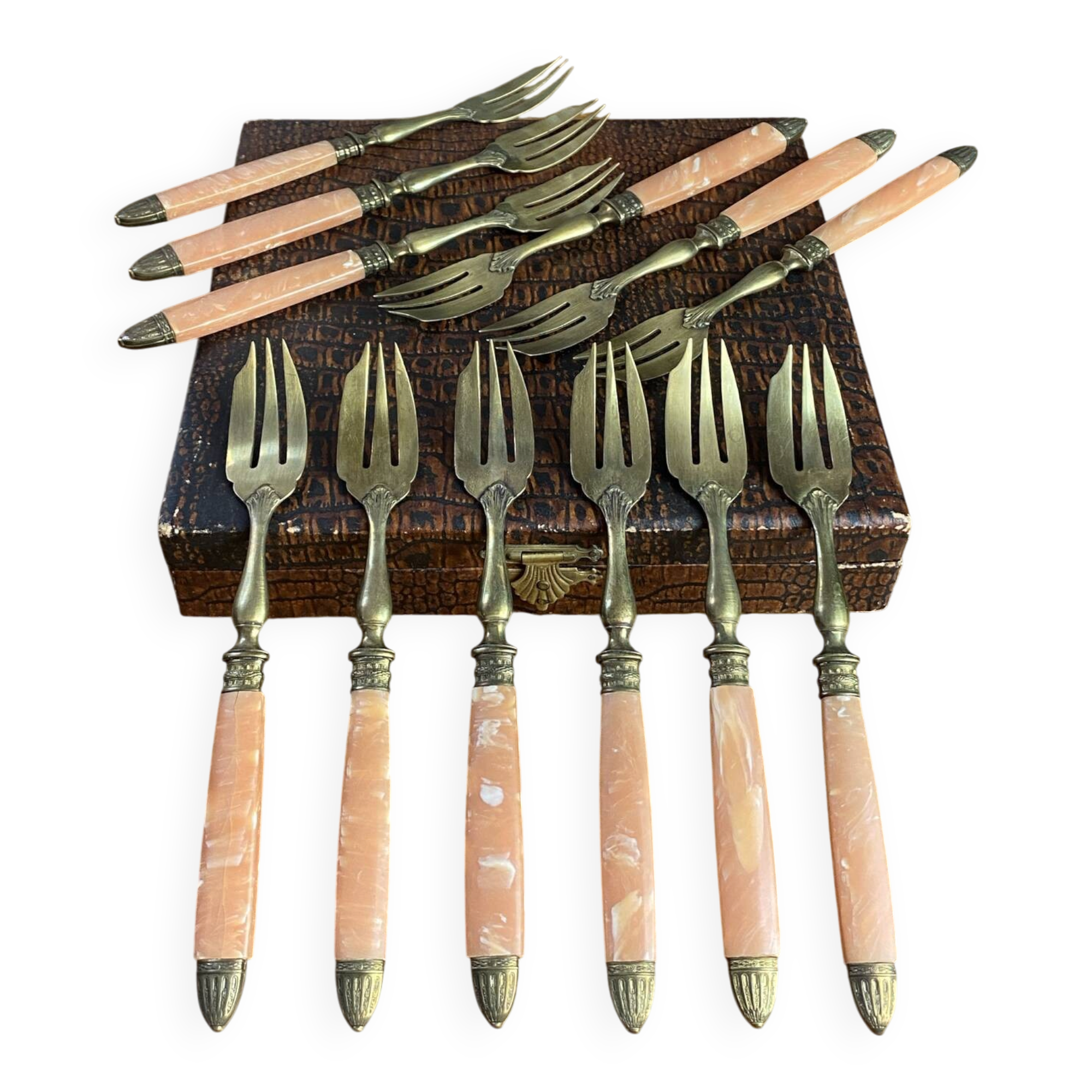 Dessert forks in brass and Bakelite in their case.