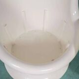 Space-age shell chair with storage, Ikea Popptorp chair.