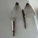 Silver Art Deco wall lights with frosted glass.