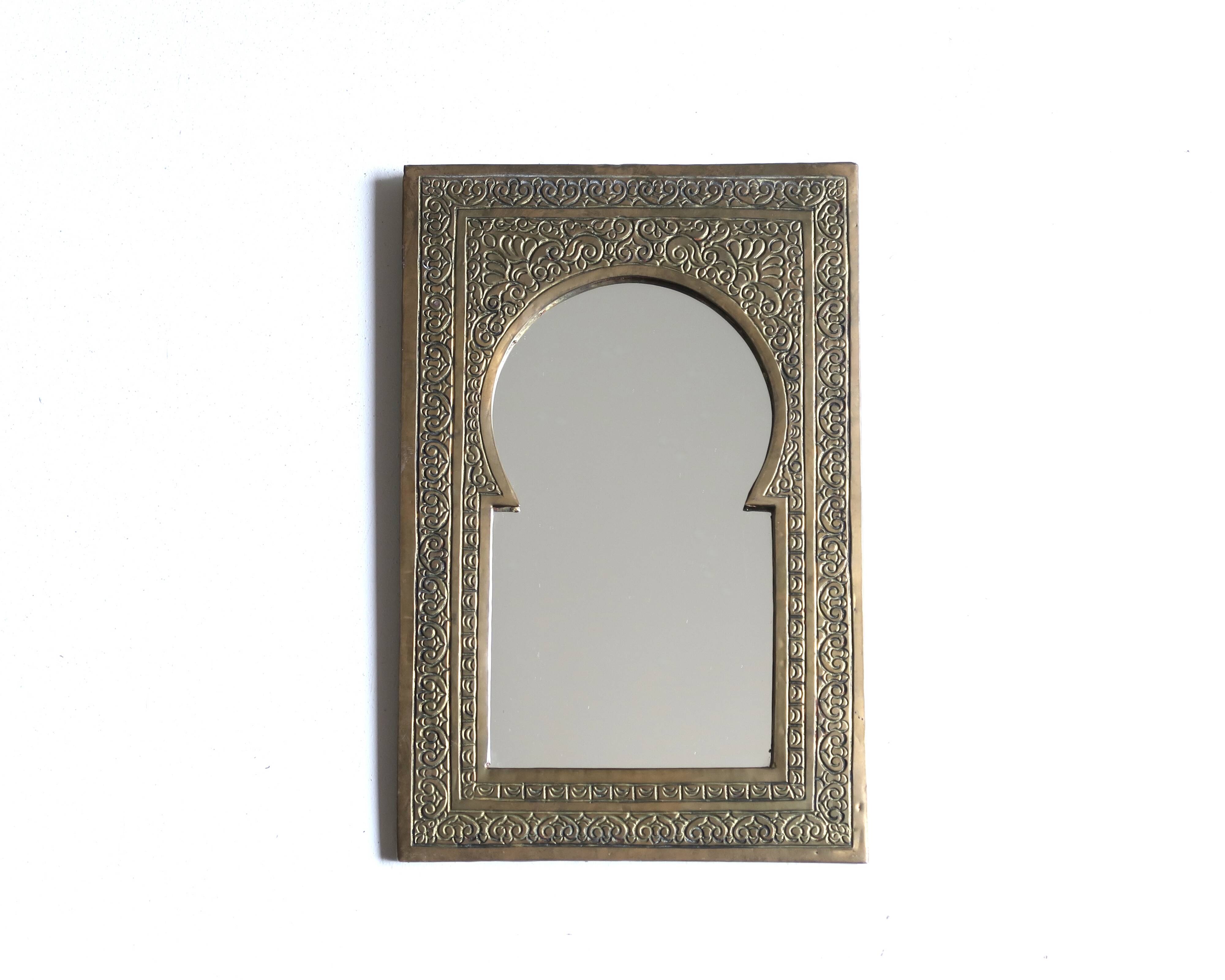 Rectangular Moroccan mirror in brass resembling a door, 1970s.