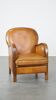 Unique, luxurious sheepskin armchair combined with wood and finished with decorative nails