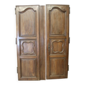 Pair of Louis XV walnut doors with medallion