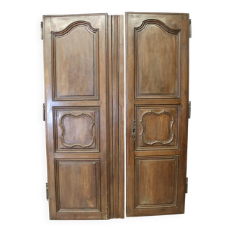 Pair of Louis XV walnut doors with medallion