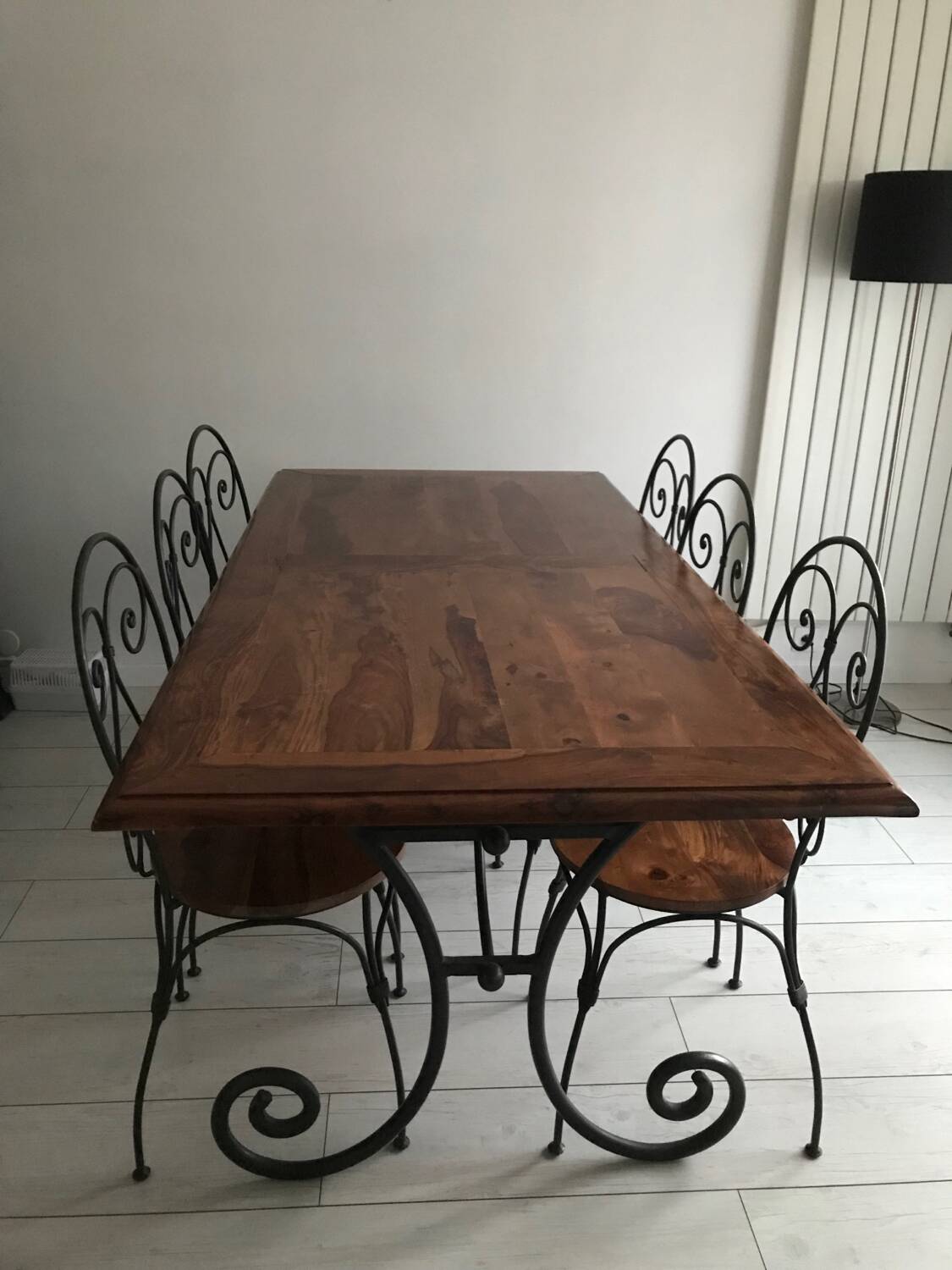 Wrought iron table with wooden top and 6 chairs