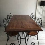 Wrought iron table with wooden top and 6 chairs