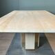 Dining table in travertine and brass. French work. Around 1970.