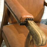 Old Voltaire armchair in light brown leather