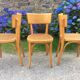 Trio de chaises cannées de style Bauman en hêtre non estampillées.