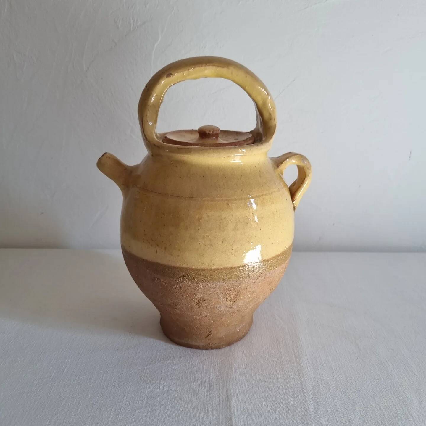 Glazed terracotta jug with lid