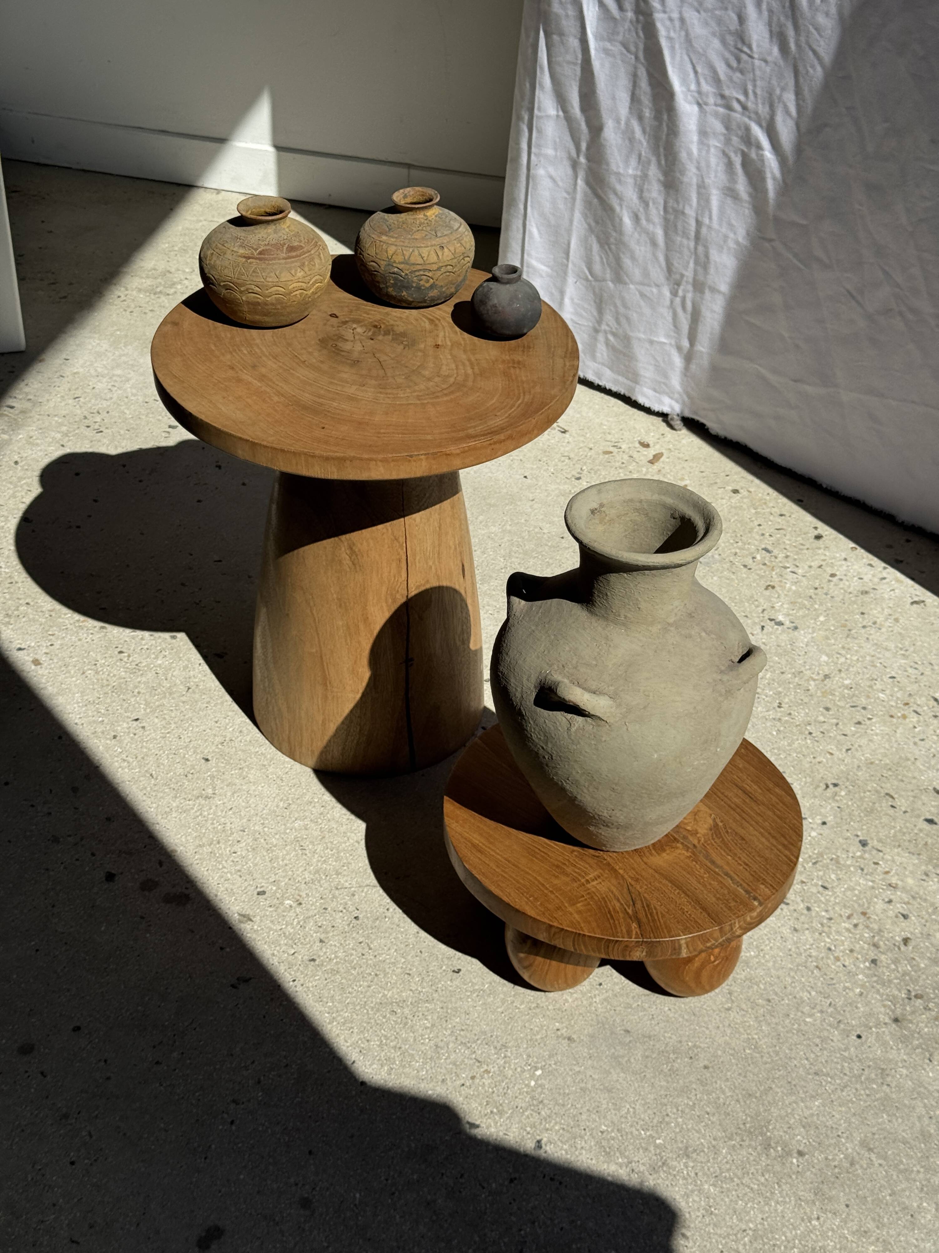 Light beige-grey Indonesian terracotta vase with 4 small handles and a high neck.