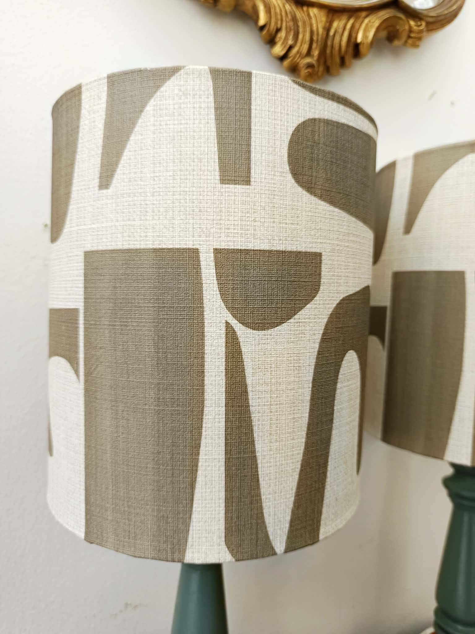 Pair of wooden lamps with custom modernist lampshades.
