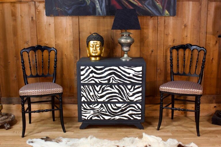 Restored chest of drawers with zebra tapestry 20th century