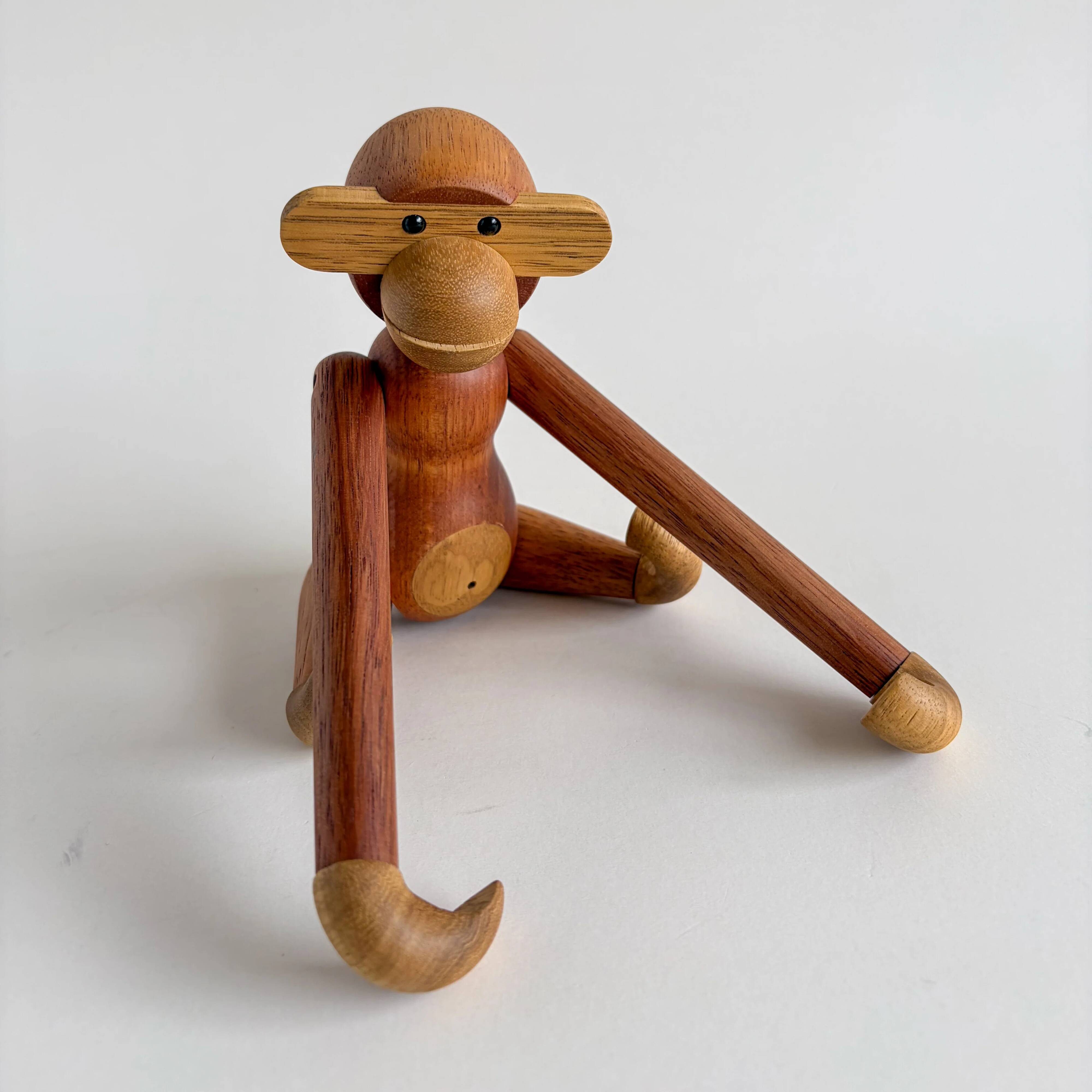 Teak monkey figurine