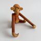 Teak monkey figurine