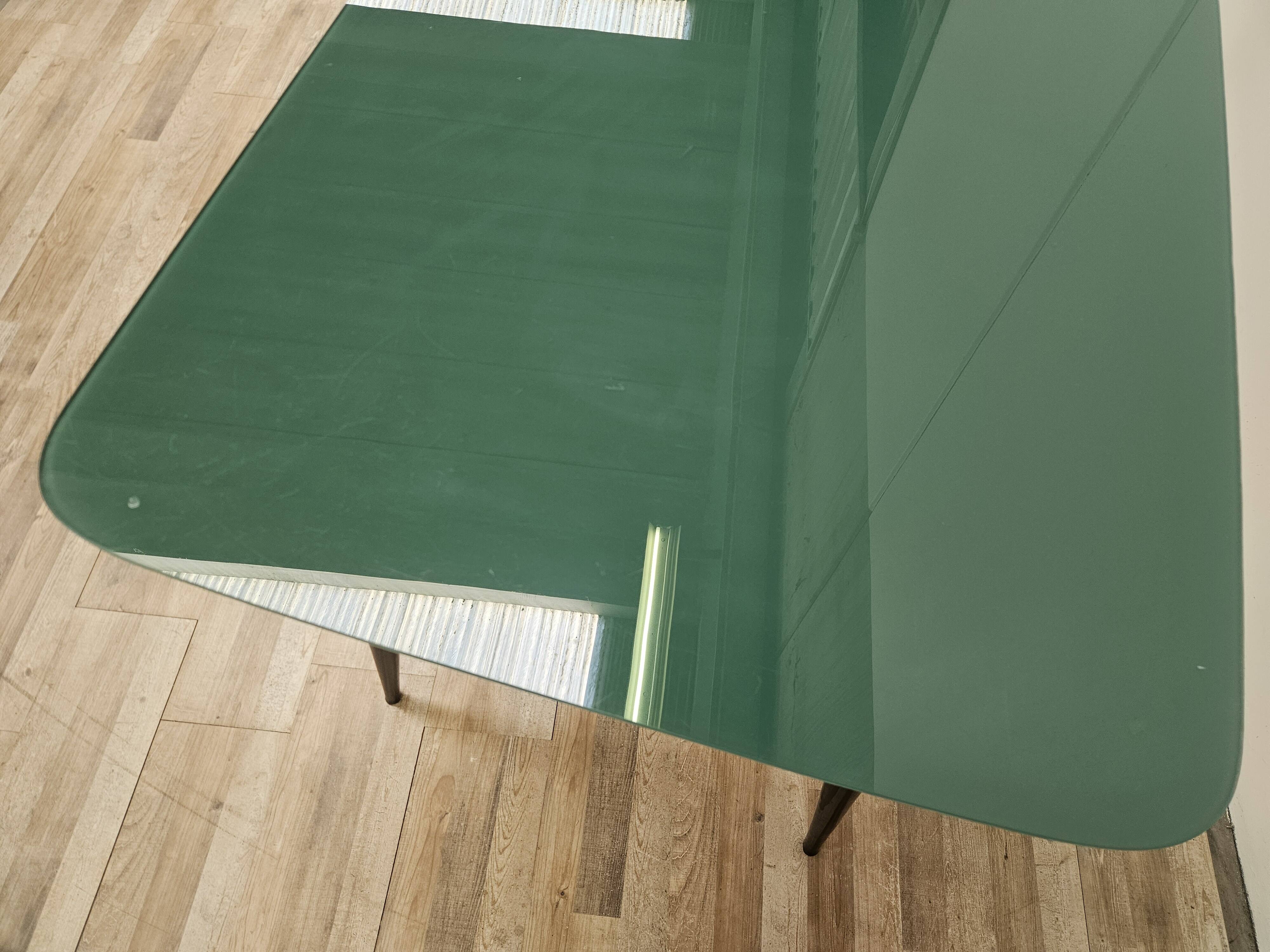 Mid-century mahogany dining table with aquamarine glass top