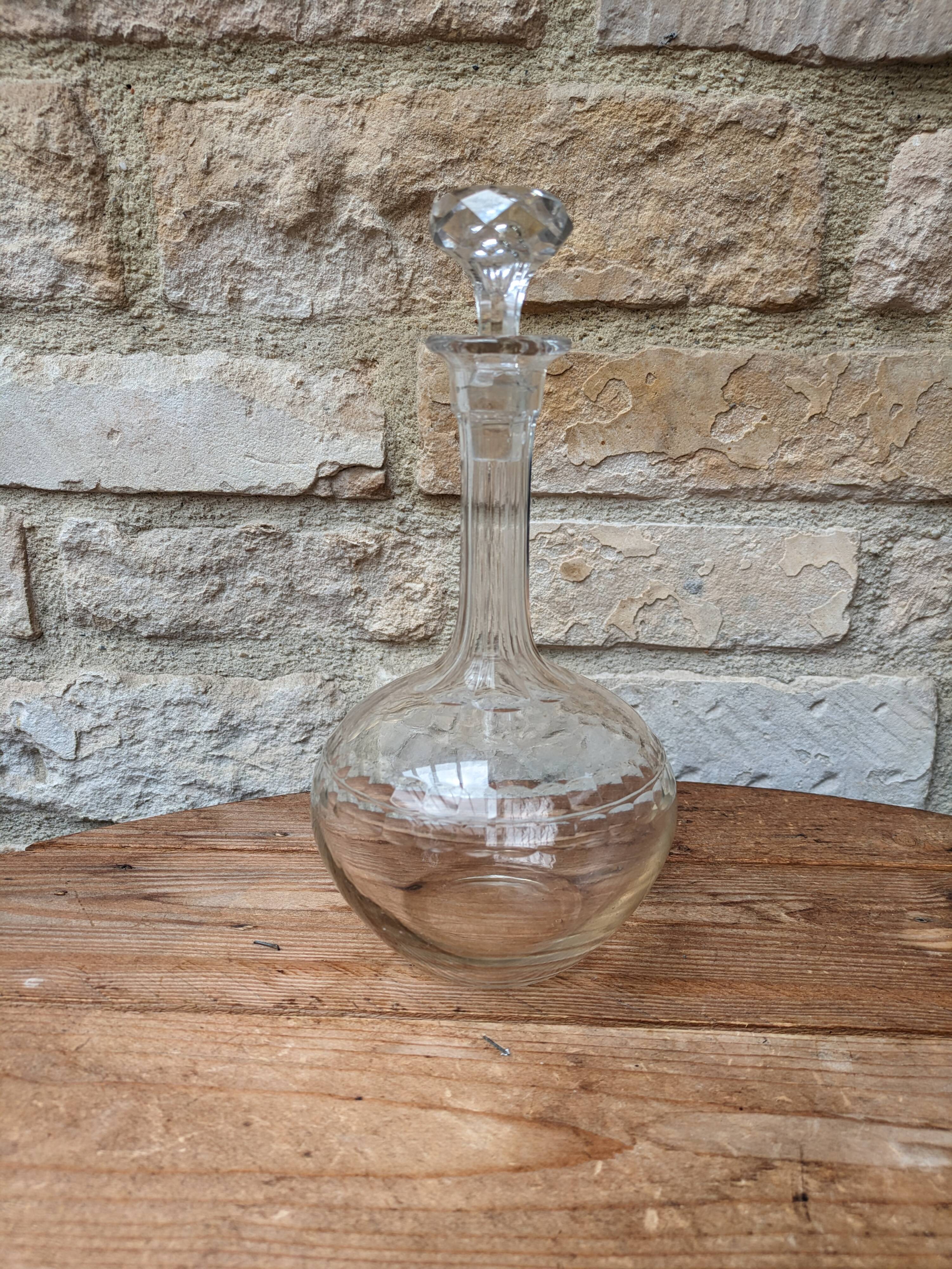 Antique round chiseled glass carafe with stopper