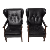 Pairs of black leather Scandinavian armchairs