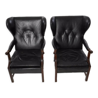 Pairs of black leather Scandinavian armchairs