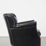 Subtle black armchair with reversible Kelim seat cushion