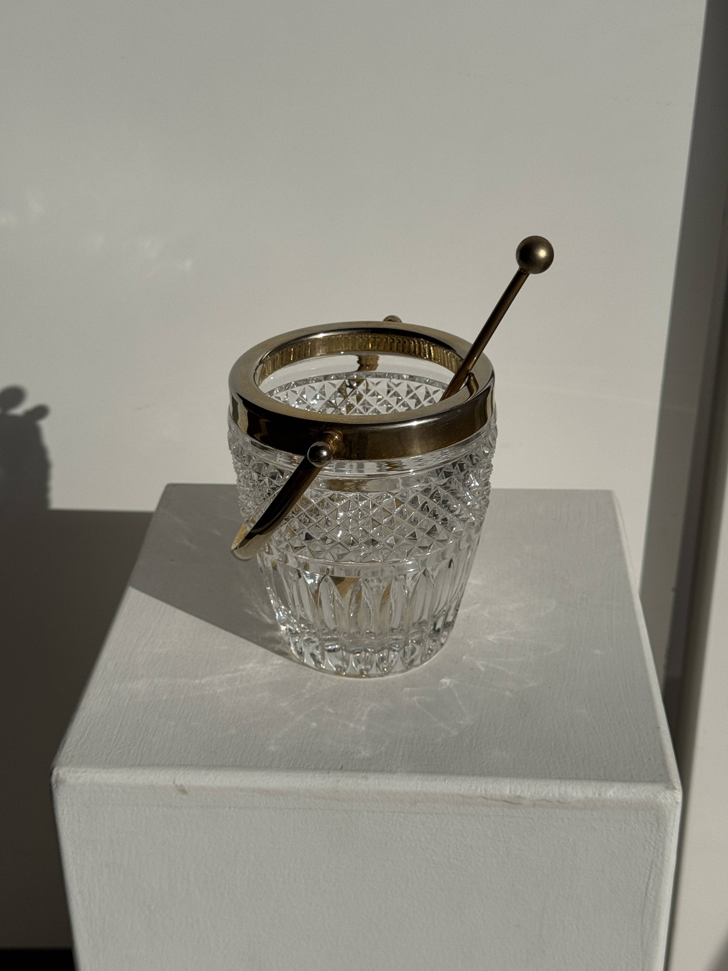 Small golden glass ice bucket with diamond point design and its scoop.