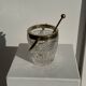 Small golden glass ice bucket with diamond point design and its scoop.