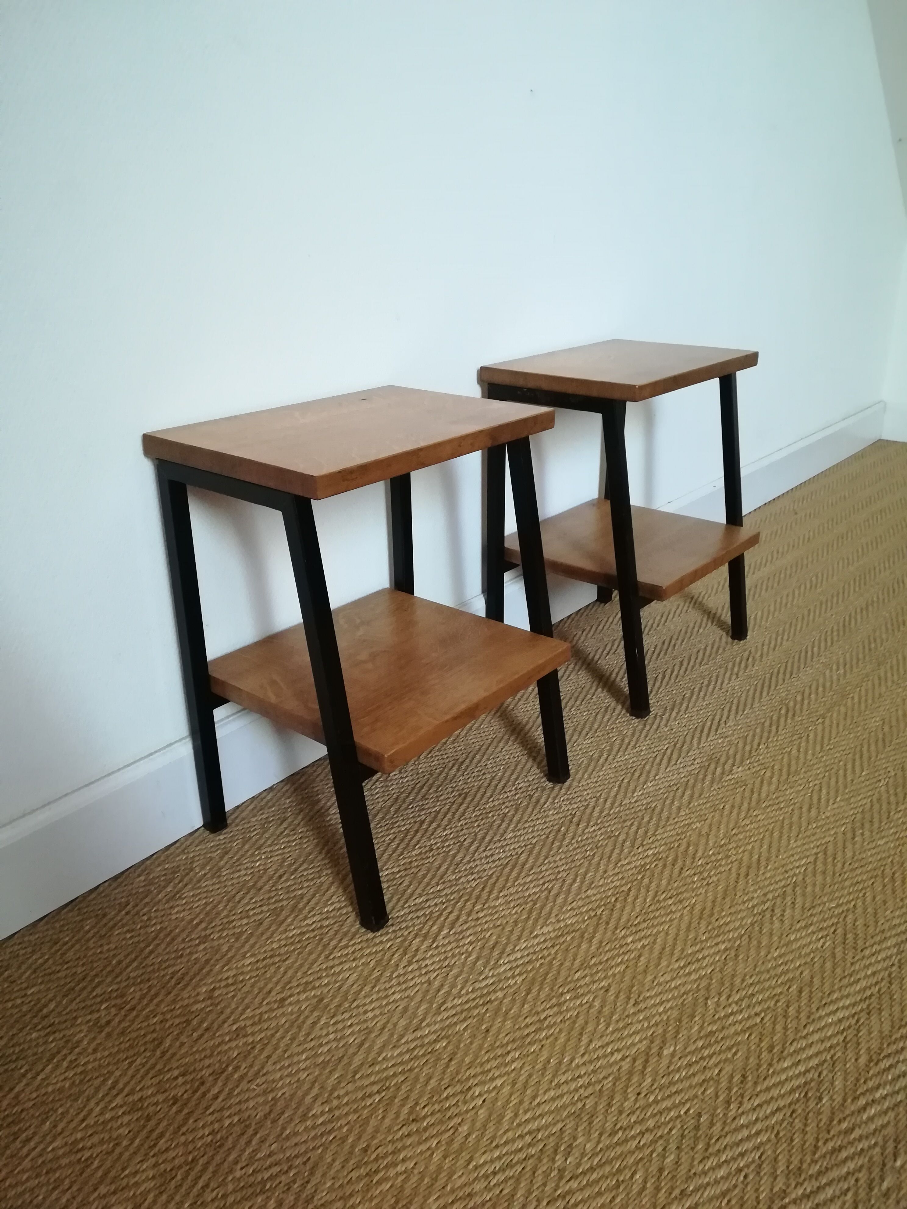 A pair of bedside tables