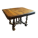 Table extensible Henri II en noyer massif