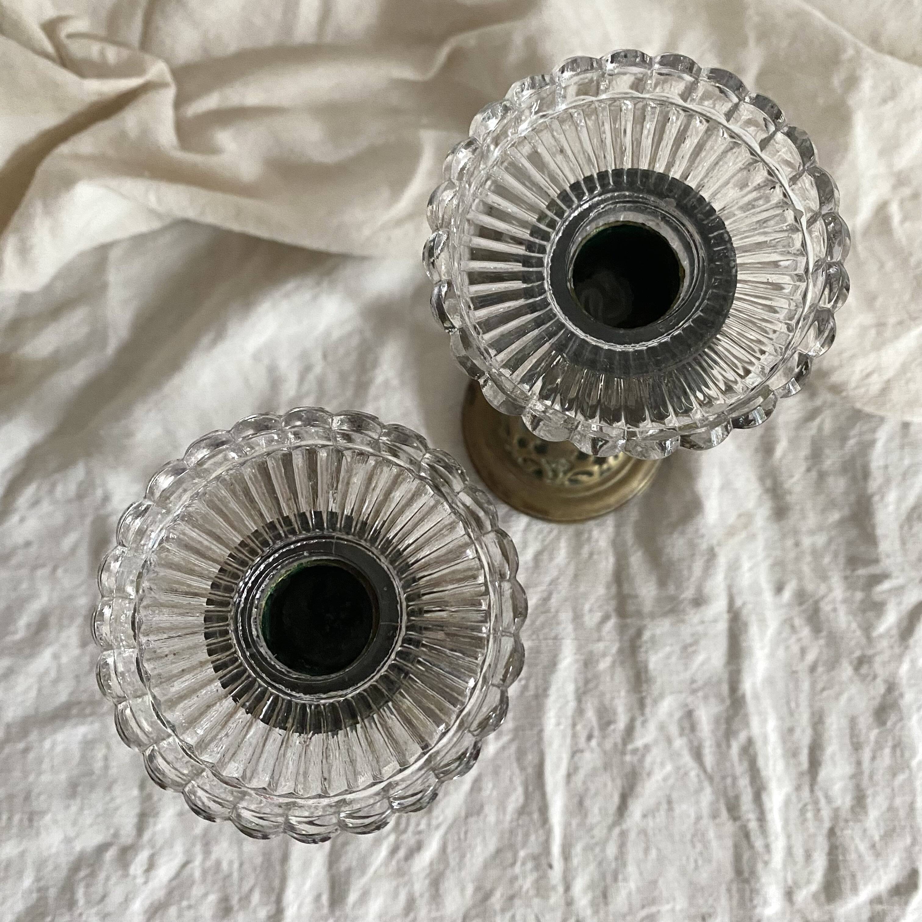 Pair of openwork brass candlesticks and glass bobeches