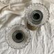 Pair of openwork brass candlesticks and glass bobeches