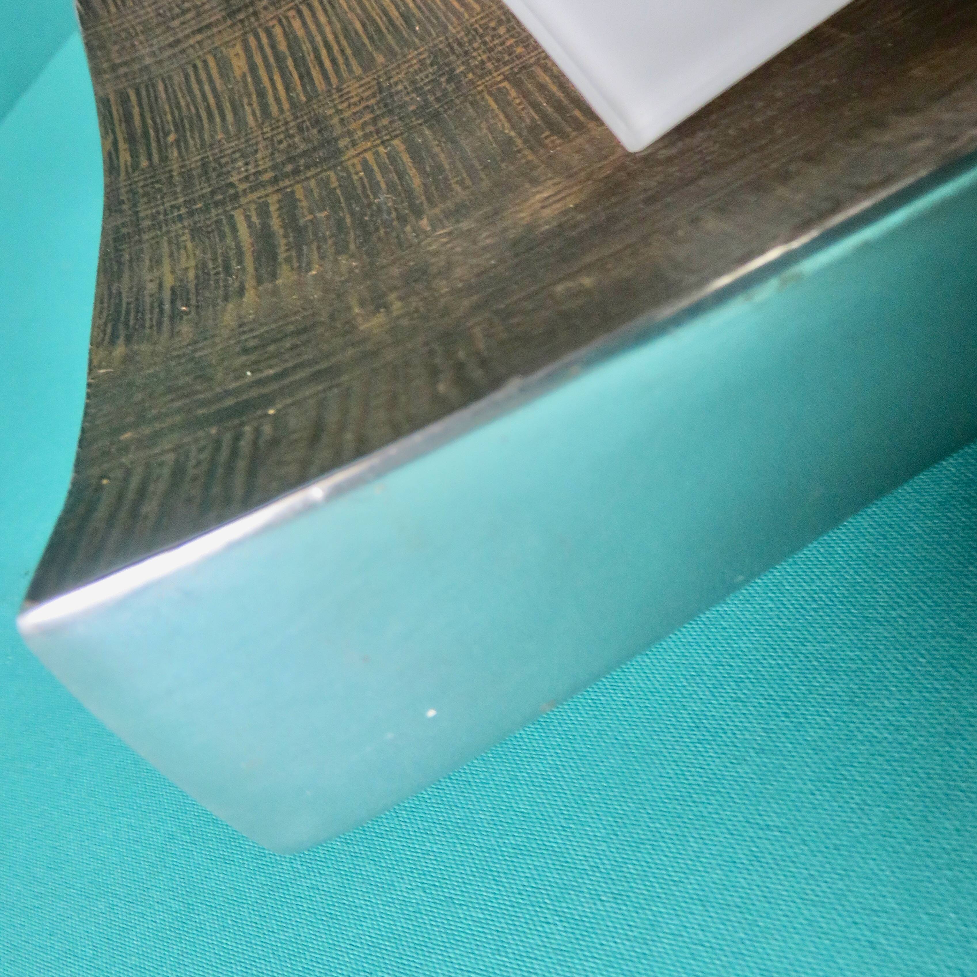 Pair of wall sconces in gold-plated alloy with bas-relief and opaline glass. Germany, 1980