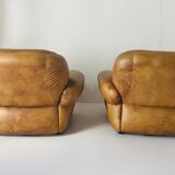 Pair of brown leather armchairs