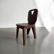 Retro brutalist chair in dark solid wood